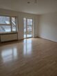 Gemütliche 2 - Zimmerwohnung mit Balkon und TG - Stellpatz in Ladenburg - Wohnzimmer.jpg